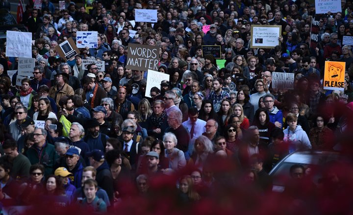 Thousands of people march through Pittsburgh to protest President Donald Trump's visit just days after 11 people were killed 