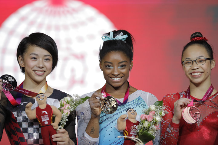 Japan&rsquo;s Mai Murakami (left) came in second place in the all-around competition with 55.798 points, Biles came in first 