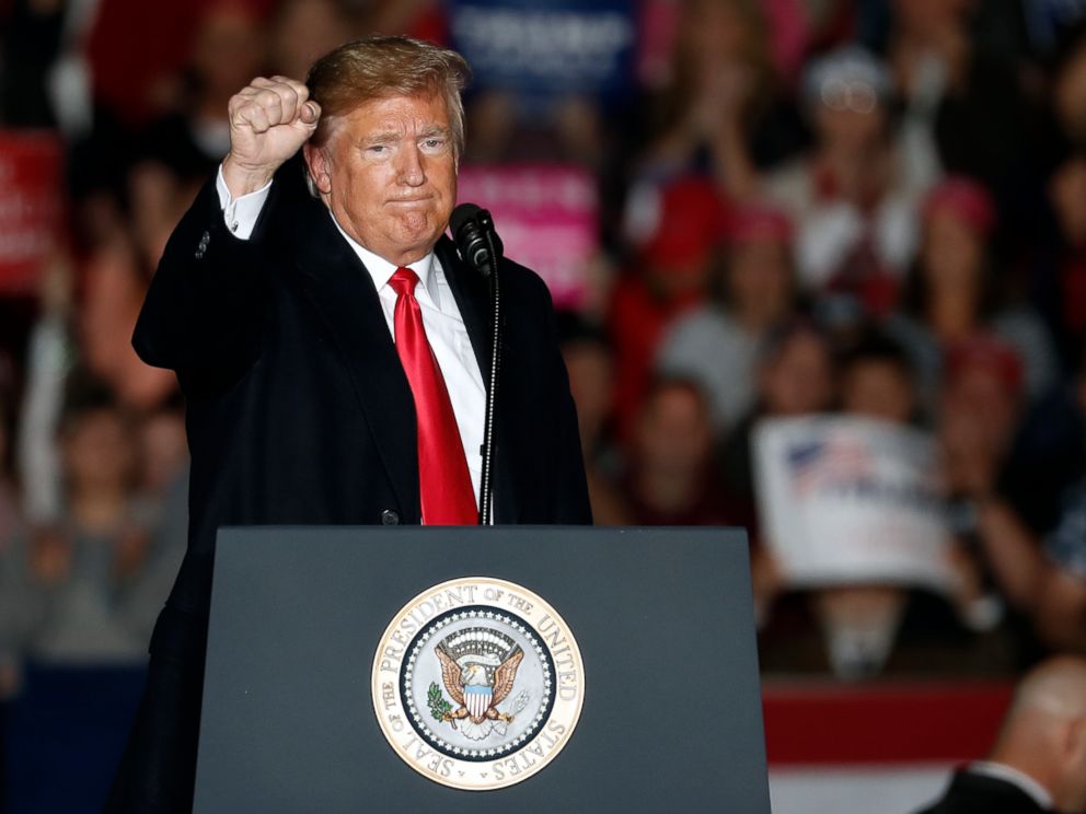 PHOTO: President Donald Trump pumps his fist as he leaves the stage after speaking to supporters during a rally at Southern Illinois Airport in Murphysboro, Ill., Oct. 27, 2018.