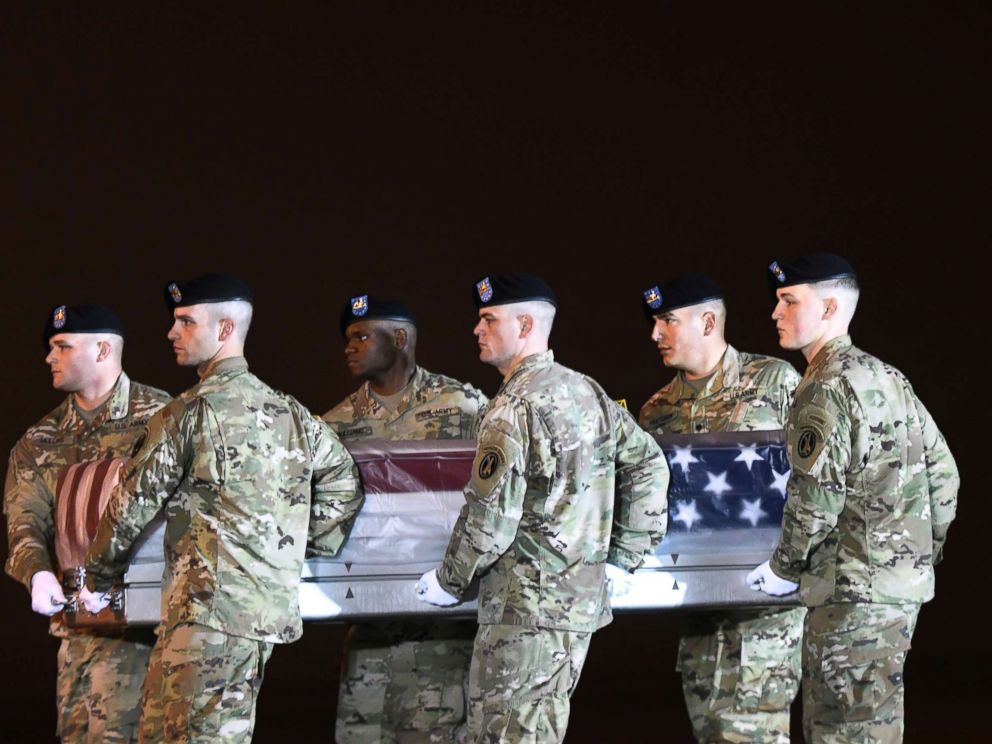 PHOTO: An Army carry team moves a transfer case containing the remains of Maj. Brent R. Taylor at Dover Air Force Base, Del., Nov. 6, 2018.