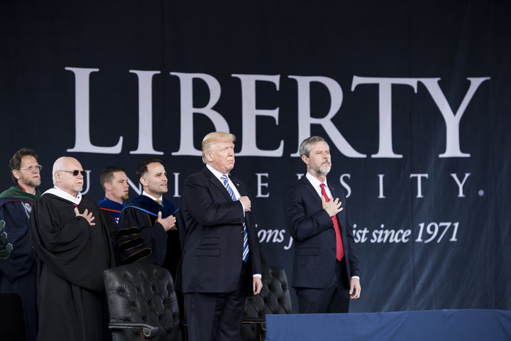 President Donald Trump and the president of Liberty University, Jerry Falwell Jr., participate in the Pledge of Allegiance du