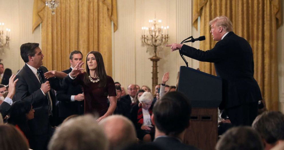 PHOTO: A White House staff member reaches for the microphone held by CNNs Jim Acosta as he questions President Donald Trump during a news conference following Tuesdays midterm elections at the White House in Washington, Nov. 7, 2018.