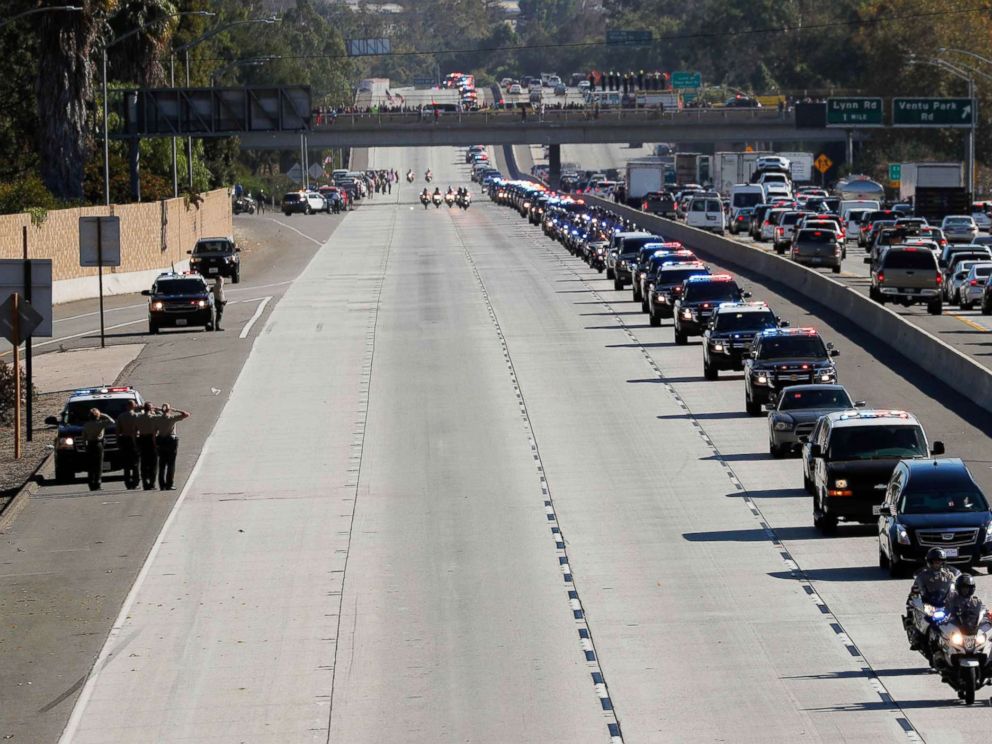 PHOTO: A procession for the body of Sergeant Ron Helus, who died in a shooting incident at a Thousand Oaks bar, drives down Ventura Highway 101 in Thousand Oaks, Calif., Nov. 8, 2018. 
