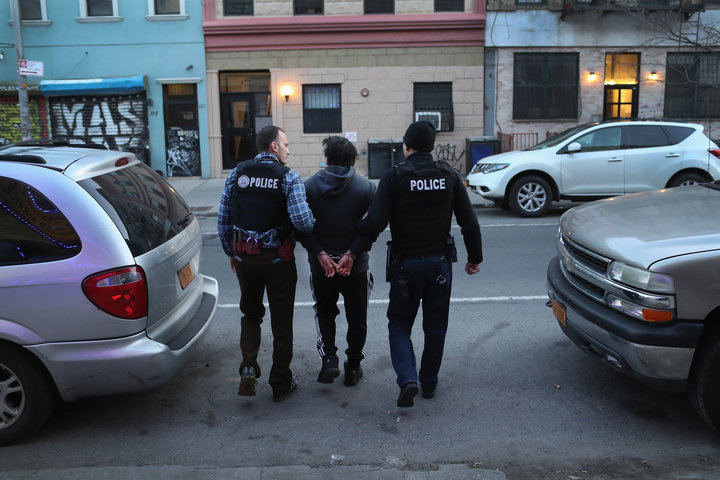 ICE officers arrest a man during a raid in Brooklyn, New York.&nbsp;