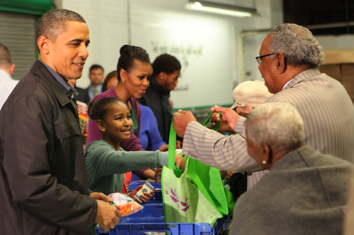 The Obamas handed out food packages at the Capital Area Food Bank in 2011.