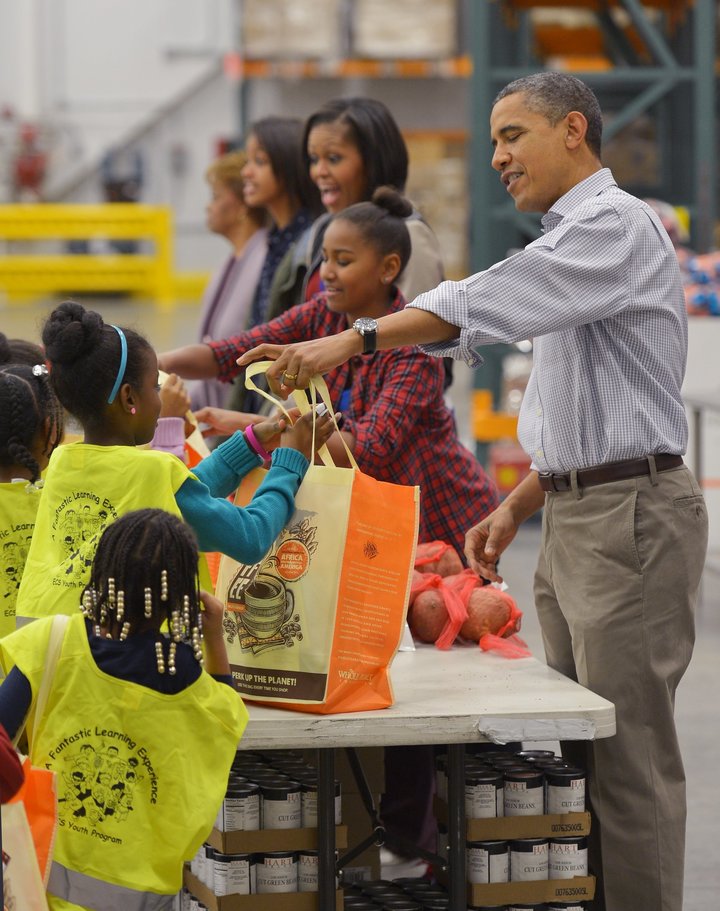 The Obamas distributed food at the Capitol Area Food Bank in Washington, DC, in 2012.
