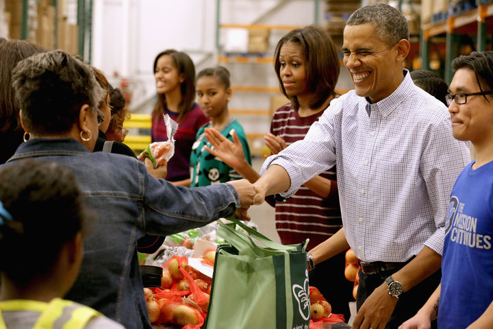 The Obamas packed and distributed bags of food at the Capital Area Food Bank in Washington, DC, in 2013.