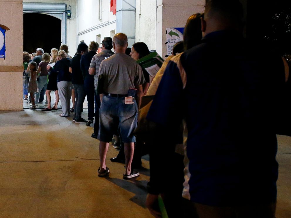 PHOTO: People wait in line to vote at a polling station in Miami, late Nov. 6, 2018. 