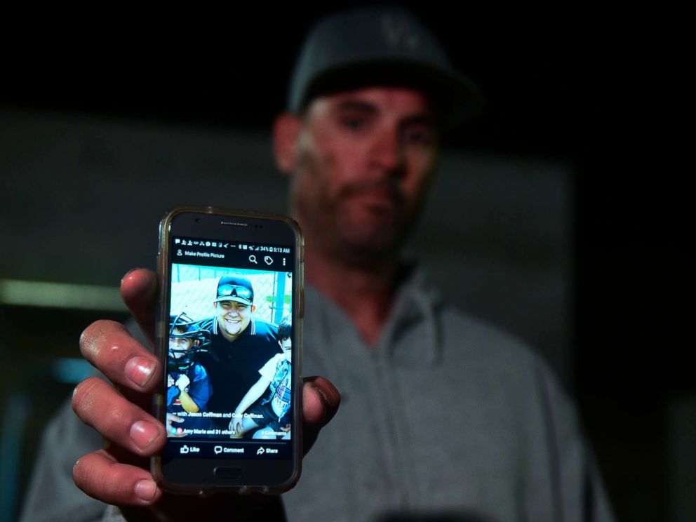 PHOTO: Jason Coffman displays a photo of his son Cody outside the Thousands Oaks Teene Center where he came hoping to find his son who was at the Borderline Bar and Grill in Thousand Oaks, Calif., Nov.8, 2018. 
