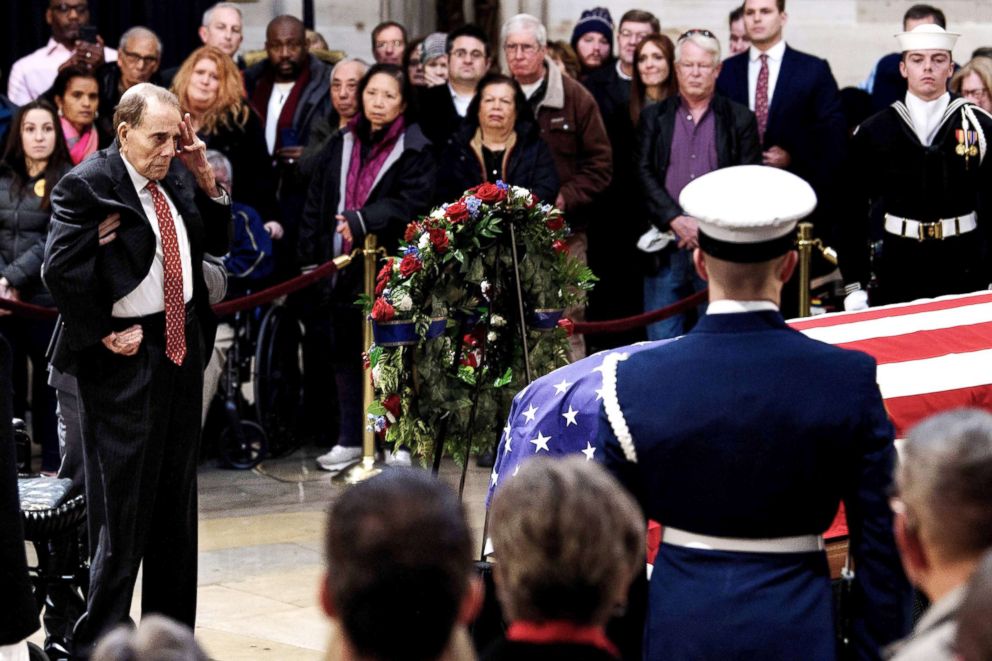 PHOTO: Former U.S. Senator Bob Dole salutes before the flag-draped coffin of former U.S. President George H. W. Bush at the U.S. Capitol rotunda in Washington, D.C., Dec. 4, 2018.