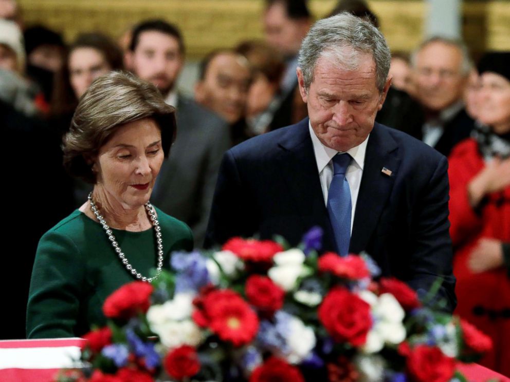 PHOTO: Former President George W. Bush and former First Lady Laura Bush stand at the flag-draped casket of former U.S. President George H.W. Bush as it lies in state inside the U.S. Capitol Rotunda in Washington, Dec. 4, 2018.
