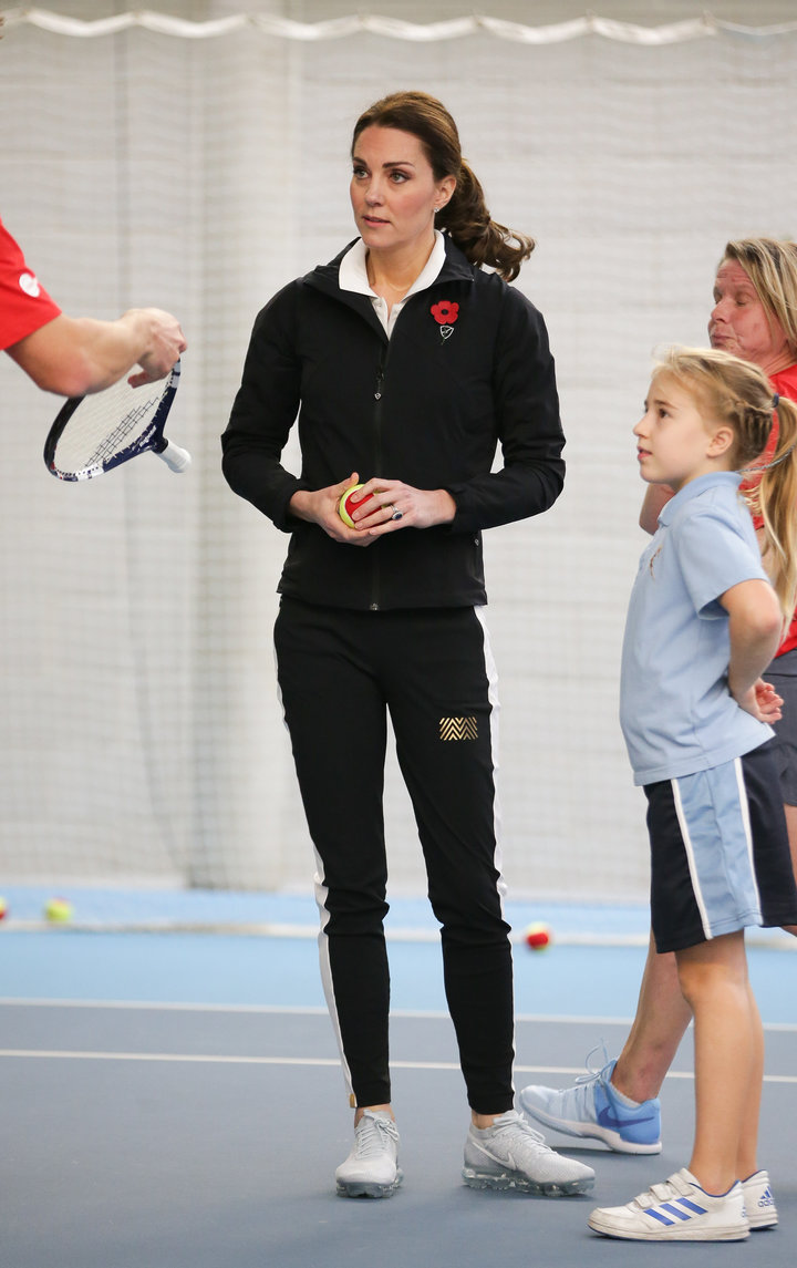 The Duchess of Cambridge takes part in a Tennis for Kids session during a visit at the Lawn Tennis Association at the Nationa