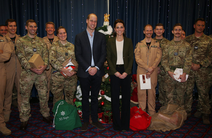 Prince William, Duke of Cambridge and Catherine, Duchess of Cambridge visit military personnel and hand out gifts.
