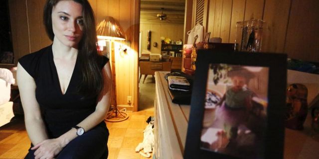 In this Feb. 13, 2017 photo, Casey Anthony poses for a portrait next to a photo of her daughter, Caylee, in her West Palm Beach, Fla., bedroom. In an exclusive interview with The Associated Press, Anthony claims the last time she saw Caylee she “believed that she was alive and that she was going to be OK.” (AP Photo/Joshua Replogle)