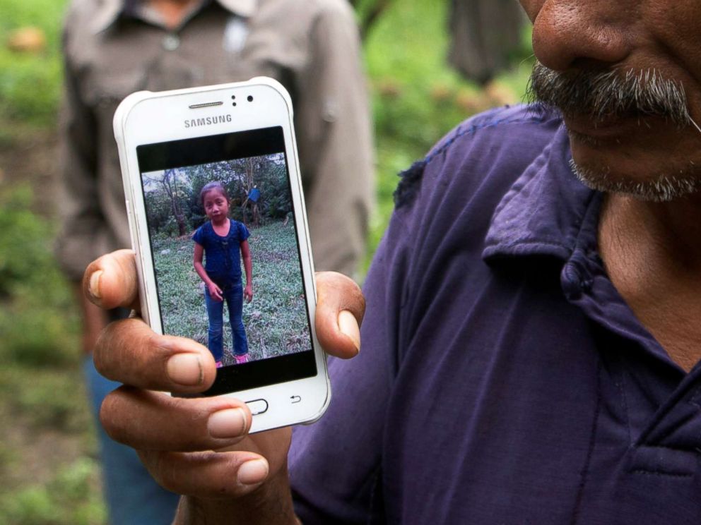 PHOTO: Domingo Caal, 61, grandfather of Jakelin, a 7-year-old girl who died in U.S. custody, holds his mobile phone with a picture of his granddaughter as he stands outside her house in Raxruha, Guatemala, Dec. 15, 2018.