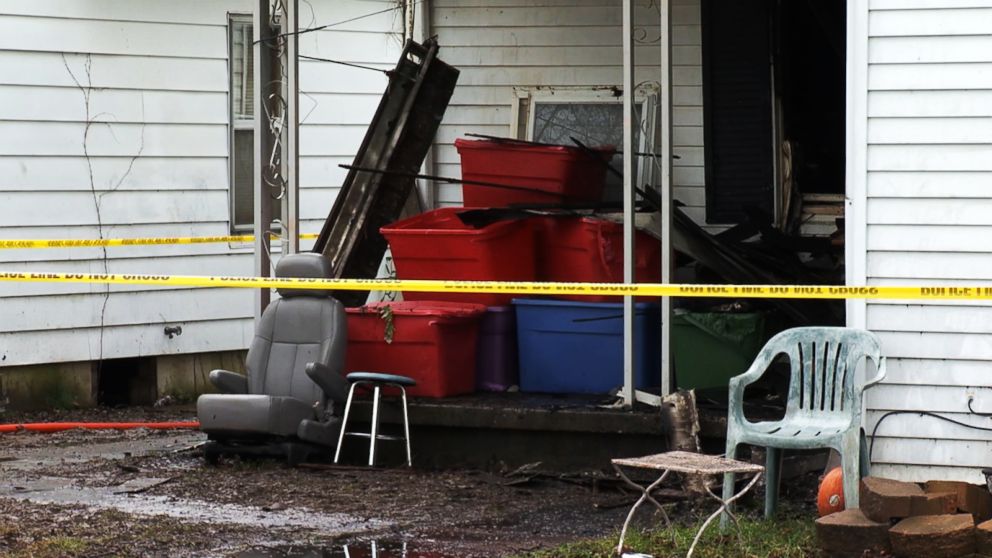 PHOTO: A yellow tape sits in front of a burned house after three children died and a mother and two siblings escaped a fire in Tell City, Ind., Dec. 28, 2018.