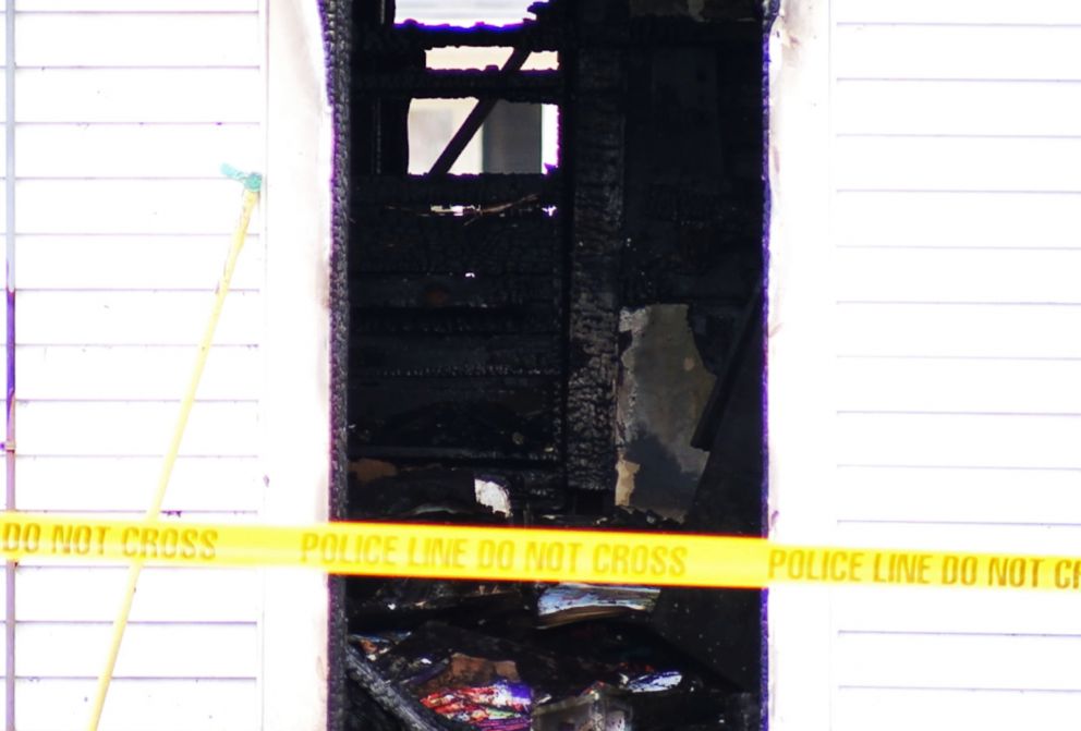 PHOTO: A yellow tape sits in front of a burned house after three children died and a mother and two siblings escaped a fire in Tell City, Ind., Dec. 28, 2018.