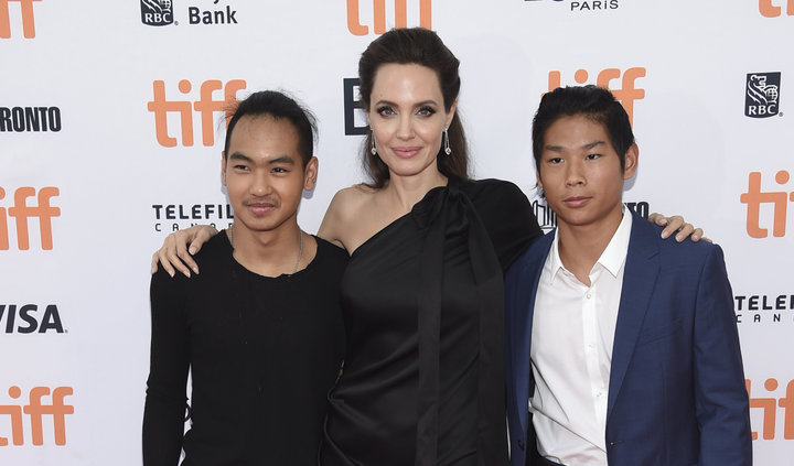 Maddox Jolie-Pitt, Angelina Jolie and Pax Jolie-Pitt attend a premiere for "First They Killed My Father" at the Toronto Inter