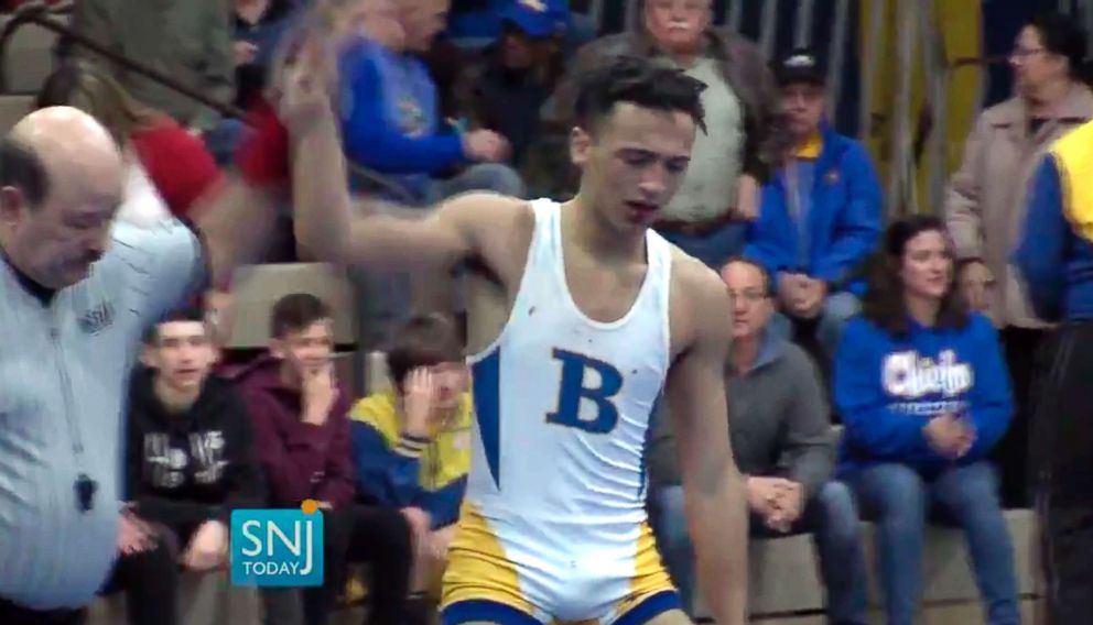 PHOTO: In this image taken from a Wednesday, Dec. 19, 2018 video provided by SNJTODAY.COM, Buena Regional High School wrestler Andrew Johnson is declared the winner after his match in in Buena, N.J.
