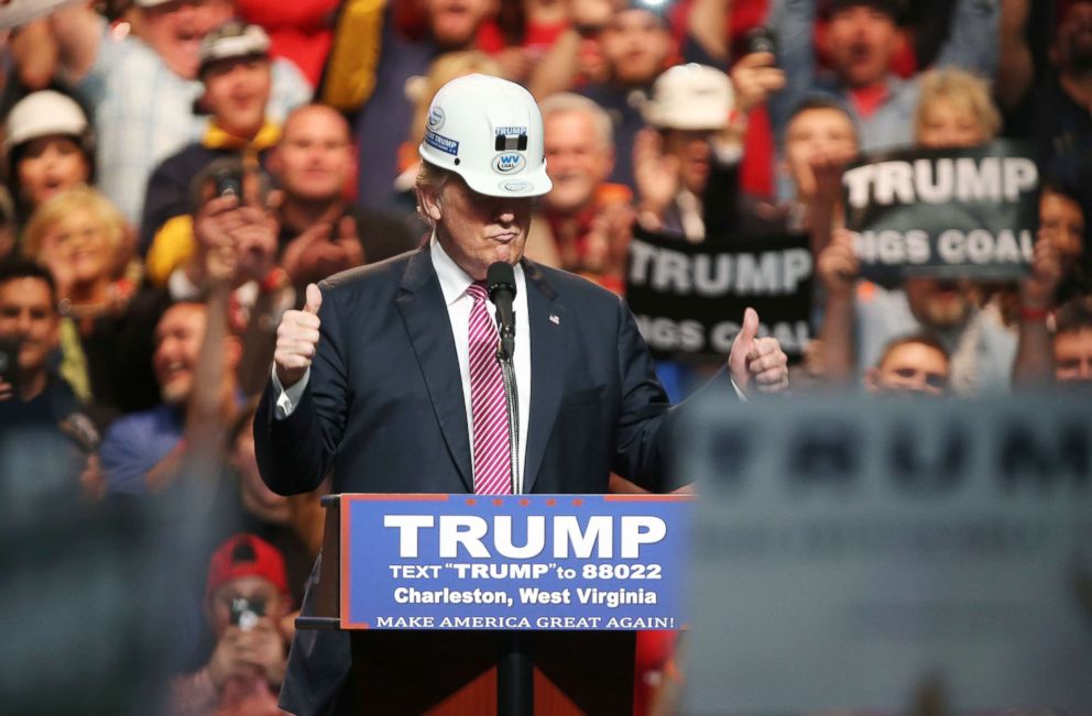 PHOTO: Republican Presidential candidate Donald Trump models a hard hat in support of the miners during his rally at the Charleston Civic Center on Charleston, W.Va, May 5, 2016.
