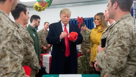 Troops bringing Trump hats to sign may violate military rule