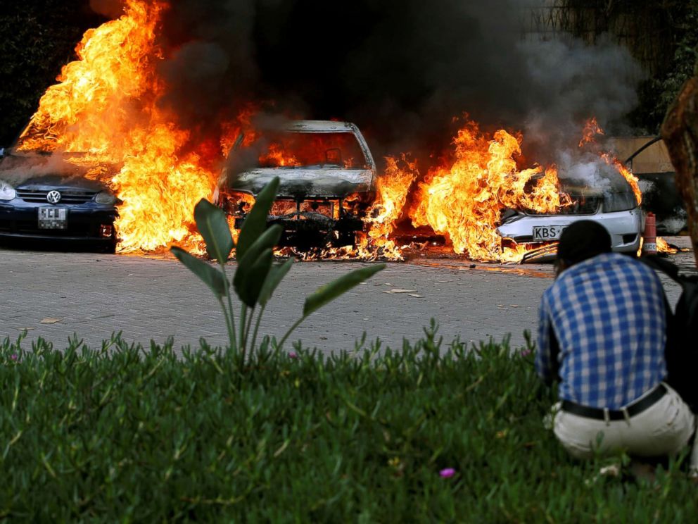 PHOTO: Cars are seen on fire at the scene of explosions and gunshots in Nairobi, Kenya, Jan. 15, 2019.