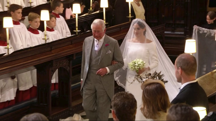Meghan Markle walks down the aisle with Prince Charles for her wedding ceremony at St. George's Chapel in Windsor Castle in W