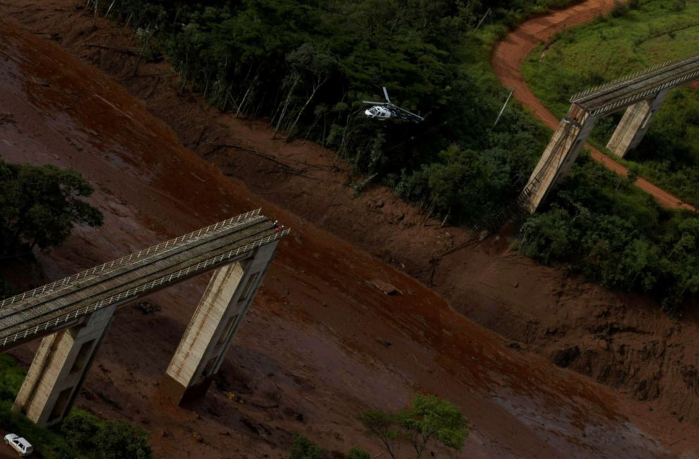 PHOTO: A helicopter flies over an area where a dam owned by Brazilian miner Vale SA burst, in Brumadinho, Brazil, Jan. 25, 2019.