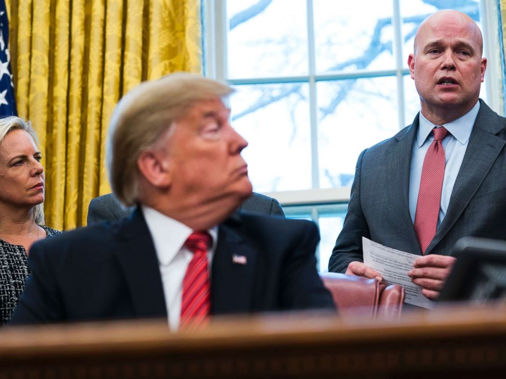PHOTO: Acting Attorney General Matthew Whitaker speaks as President Donald Trump looks on at the signing ceremony for the Frederick Douglass Trafficking Victims Prevention and Protection Reauthorization Act, in the Oval Office, Jan. 9, 2019.