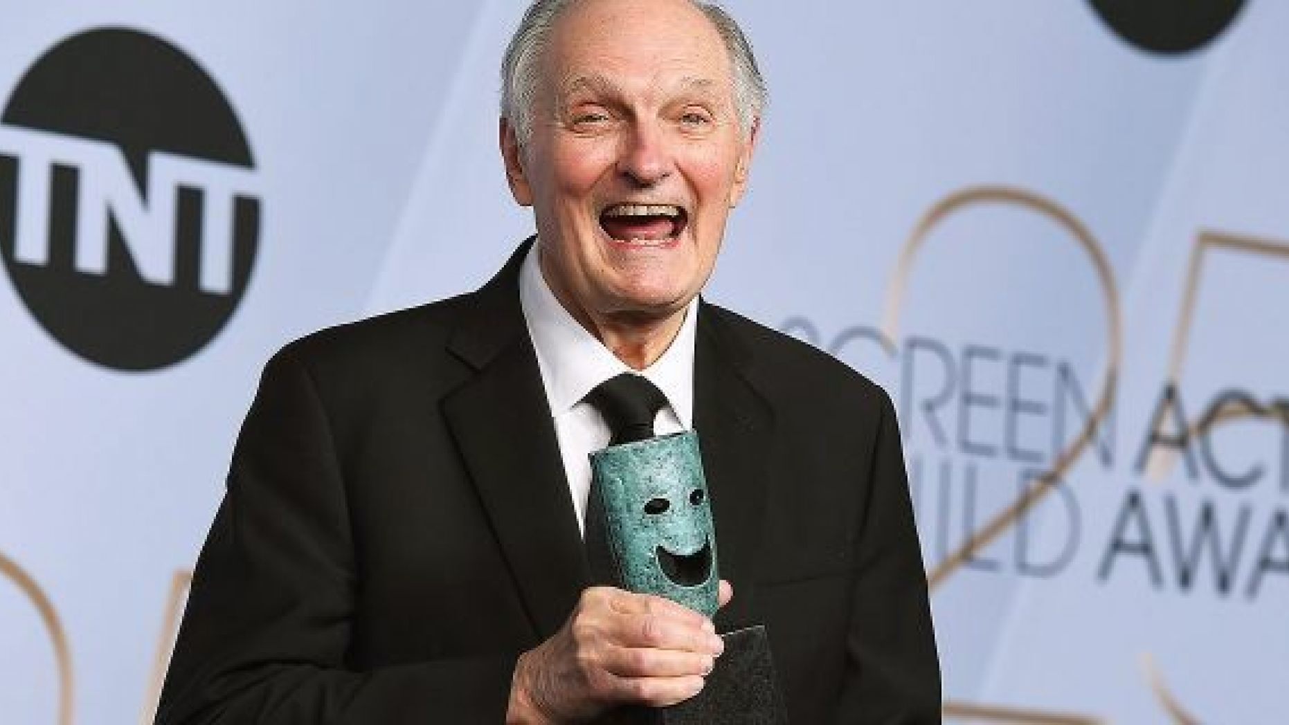 Alan Alda poses with the Life Achievement Award in the press room at the 25th annual Screen Actors Guild Awards.