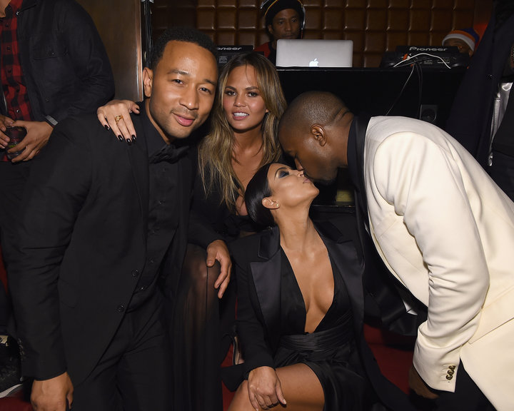 John Legend and Chrissy Teigen pose with Kim Kardashian and Kanye West at the singer's birthday party in 2015.