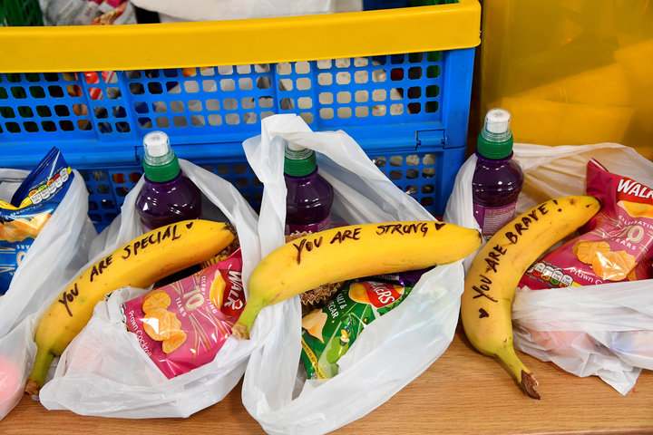 Meghan wrote affirmations on bananas for snack bags that the charity distributes.