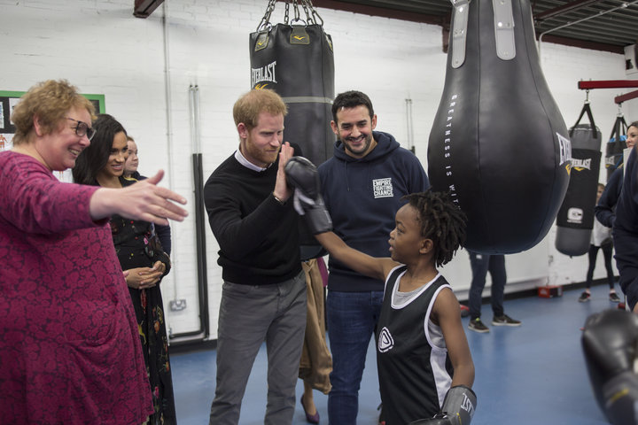 Meghan and Harry meet 7-year-old Aziah Selassie during their visit to Empire Fighting Chance.