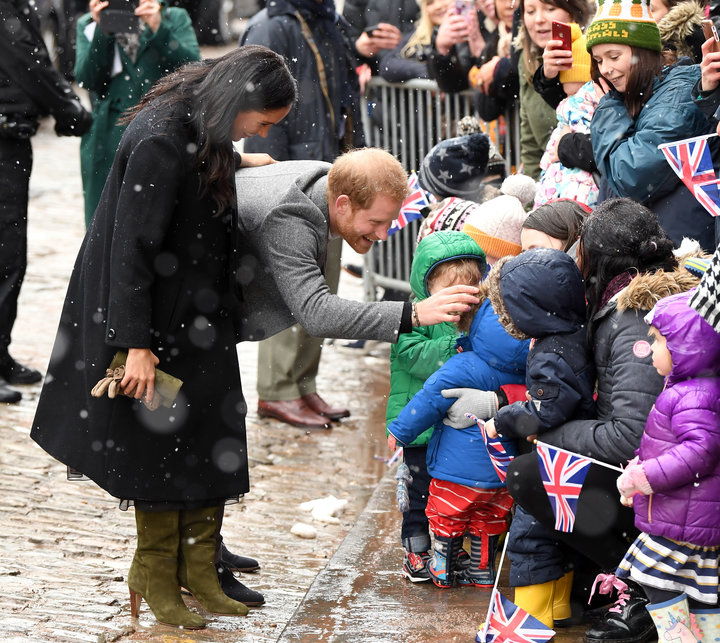 Meghan and Harry chat with a group of schoolchildren.