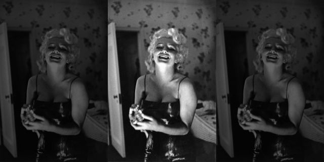 NEW YORK - MARCH 24: Actress Marilyn Monroe gets ready to go see the play "Cat On A Hot Tin Roof" playfully applying her makeup and Chanel No. 5 Perfume on March 24, 1955 at the Ambassador Hotel in New York City, New York.