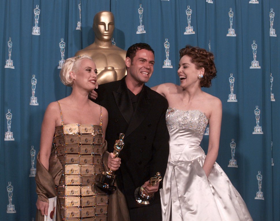 Lizzy Gardiner (left) and&nbsp;Tim Chappel, who won Best Costume Design in 1995, with presenter Sharon Stone.