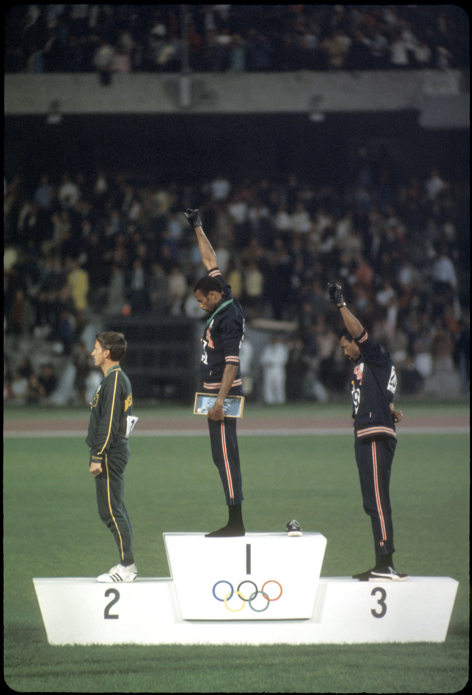 Tommie Smith and John Carlos raise their fists in a demonstration against American racism during the 1968 Olympic games.&nbsp