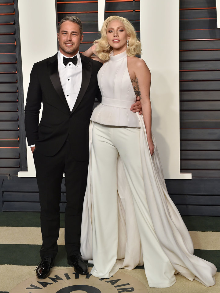 Taylor Kinney and Lady Gaga arrive at the 2016 Vanity Fair Oscars after-party.