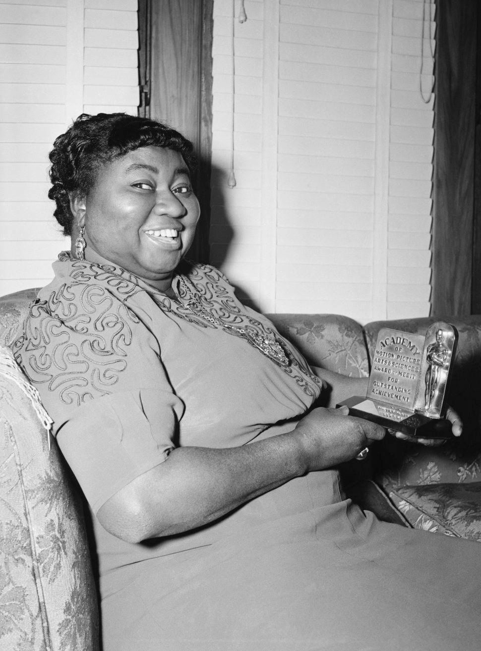 Hattie McDaniel holds her Academy Award after being named "Best Supporting Actress" for her portrayal of "Mammy" in "Gone wit