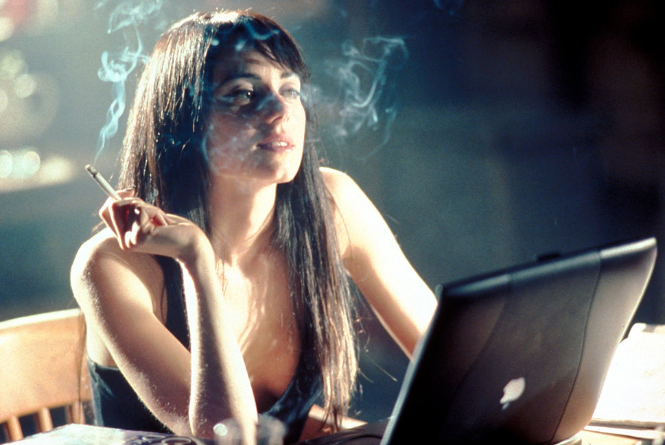 Ms. Jenny Schecter writing on her dated Macbook, reflecting on loves lost.