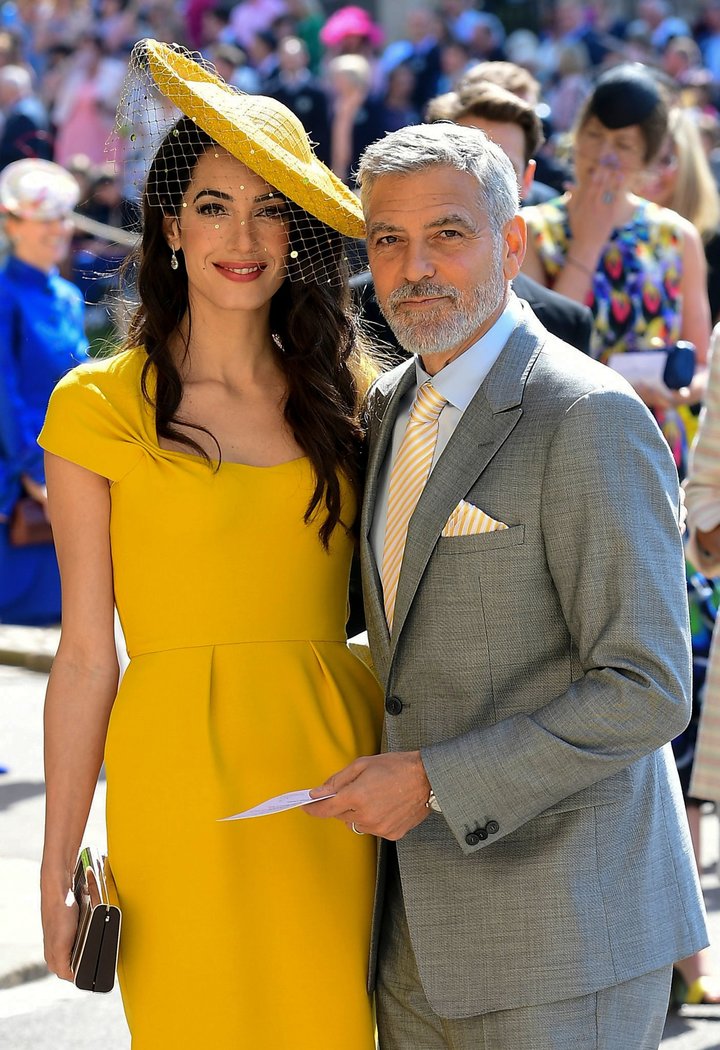 Amal and George Clooney pose together on the day of the royal wedding at St George's Chapel, Windsor Castle, in Windsor, on M