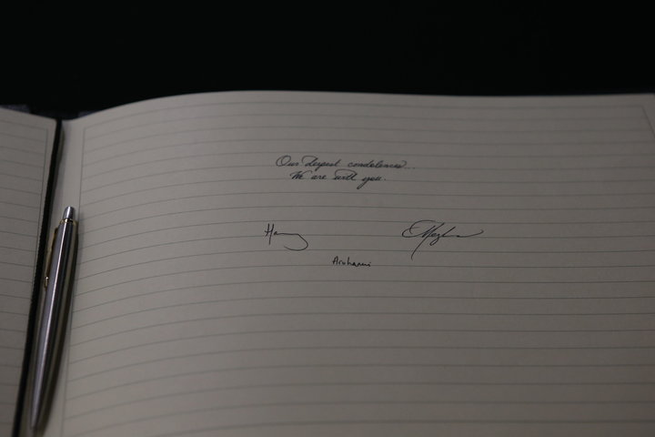 Harry and Meghan's signatures in the book of condolences.&nbsp;