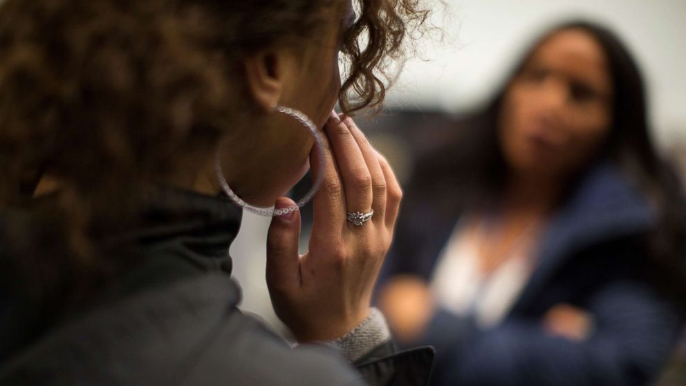An unidentified victim of sex trafficking speaks with a counselor at My Life My Choice, an anti-human trafficking agency in Boston, March 24, 2016.
