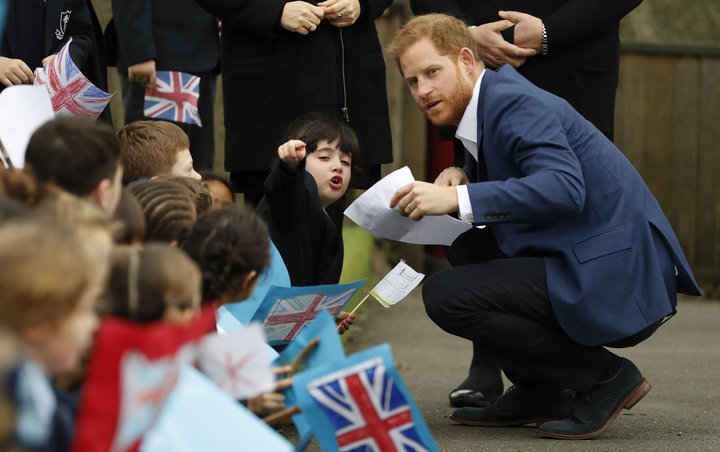The Duke of Sussex&nbsp;speaks to 6-year-old Stella, a pupil at St. Vincent's Catholic Primary School.