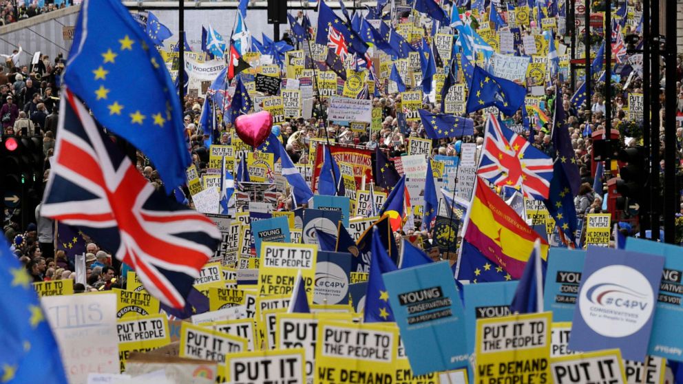 Demonstrators carry posters and flags during a Peoples Vote anti-Brexit march in London, March 23, 2019. The march, organized by the People's Vote campaign is calling for a final vote on any proposed Brexit deal.