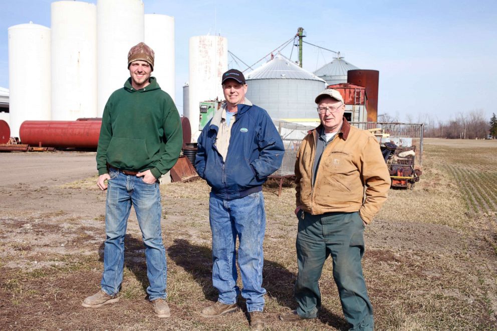 Third generation farmer Donald Wendland Jr. in  Saginaw, Michigan photographed with his father and son.