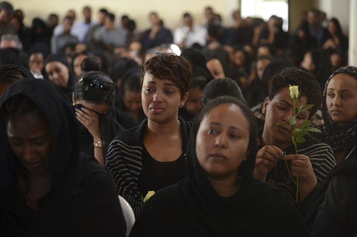 Mourners attend a memorial service Monday for Ethiopian Airlines crew members and other victims of the crash near Addis Ababa