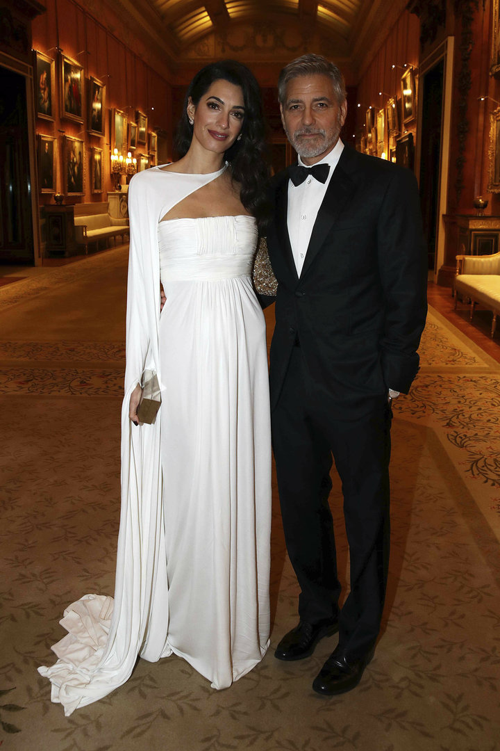 Amal and George Clooney attend a dinner to celebrate The Prince's Trust, hosted by Prince Charles, at Buckingham Palace on Ma