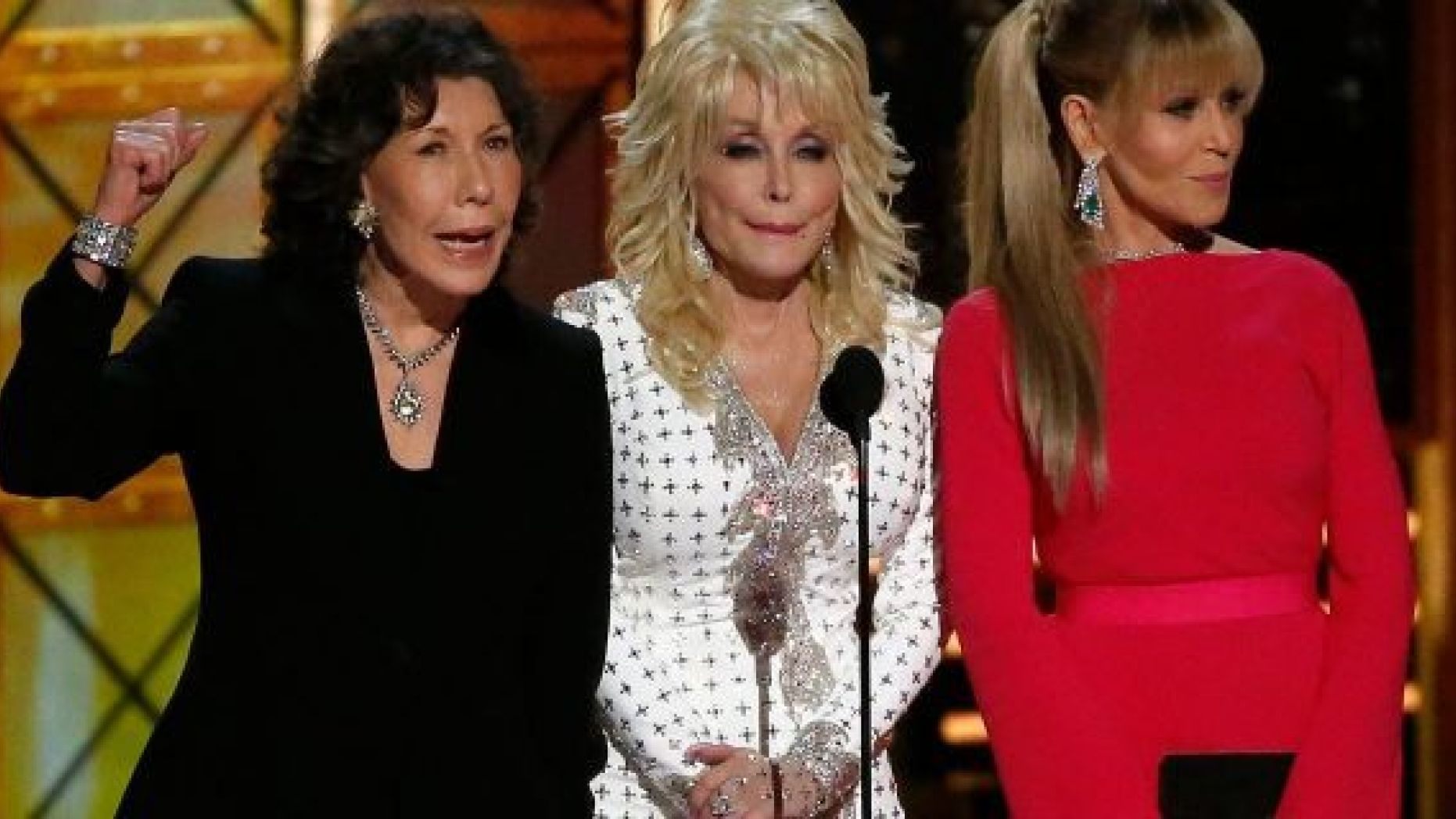 Dolly Parton (center) remained tight lipped when Lily Tomlin (left) and Jane Fonda (right) cracked a Trump joke at the 2017 Emmys.