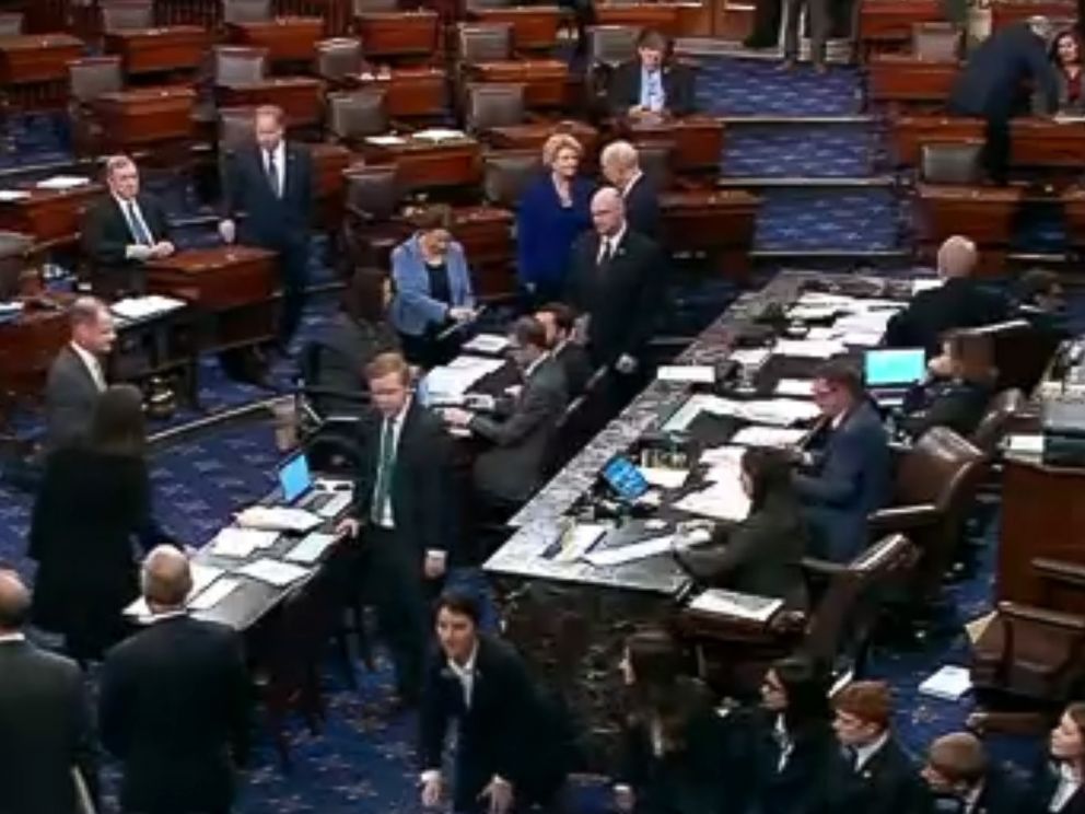 PHOTO: An image made from video shows politicians and staff on the floor of the U.S. Senate and the vote tally for terminating President Donald Trumps border emergency declaration, in Washington, March 14, 2019.